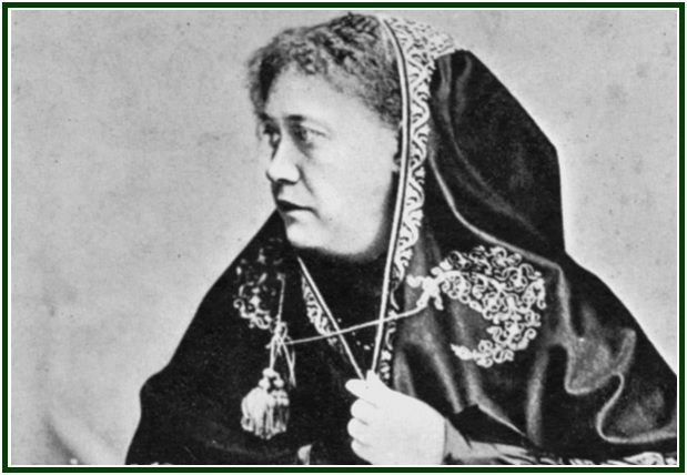 Historical profile photograph of H.P. Blavatsky with an embroidered dark head covering.