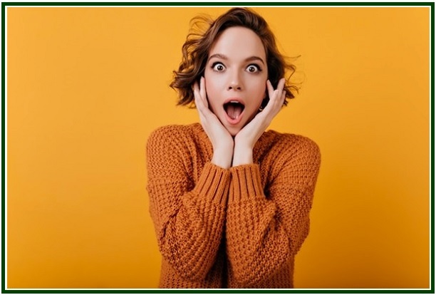 Shocked expression of a young woman looking sideways, representing the reaction when sharing your spiritual journey.